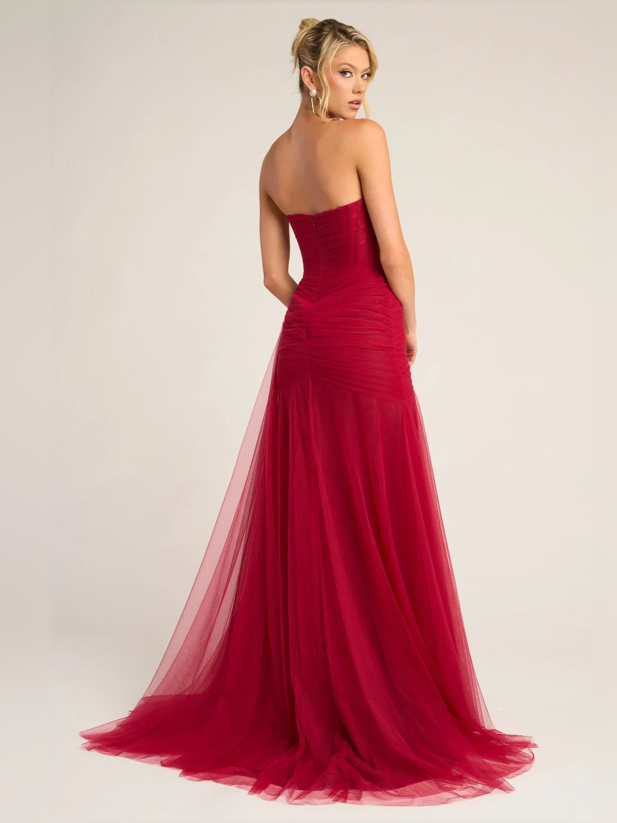 Black mermaid floor-length formal dress with draping, alternate view showing the hem
