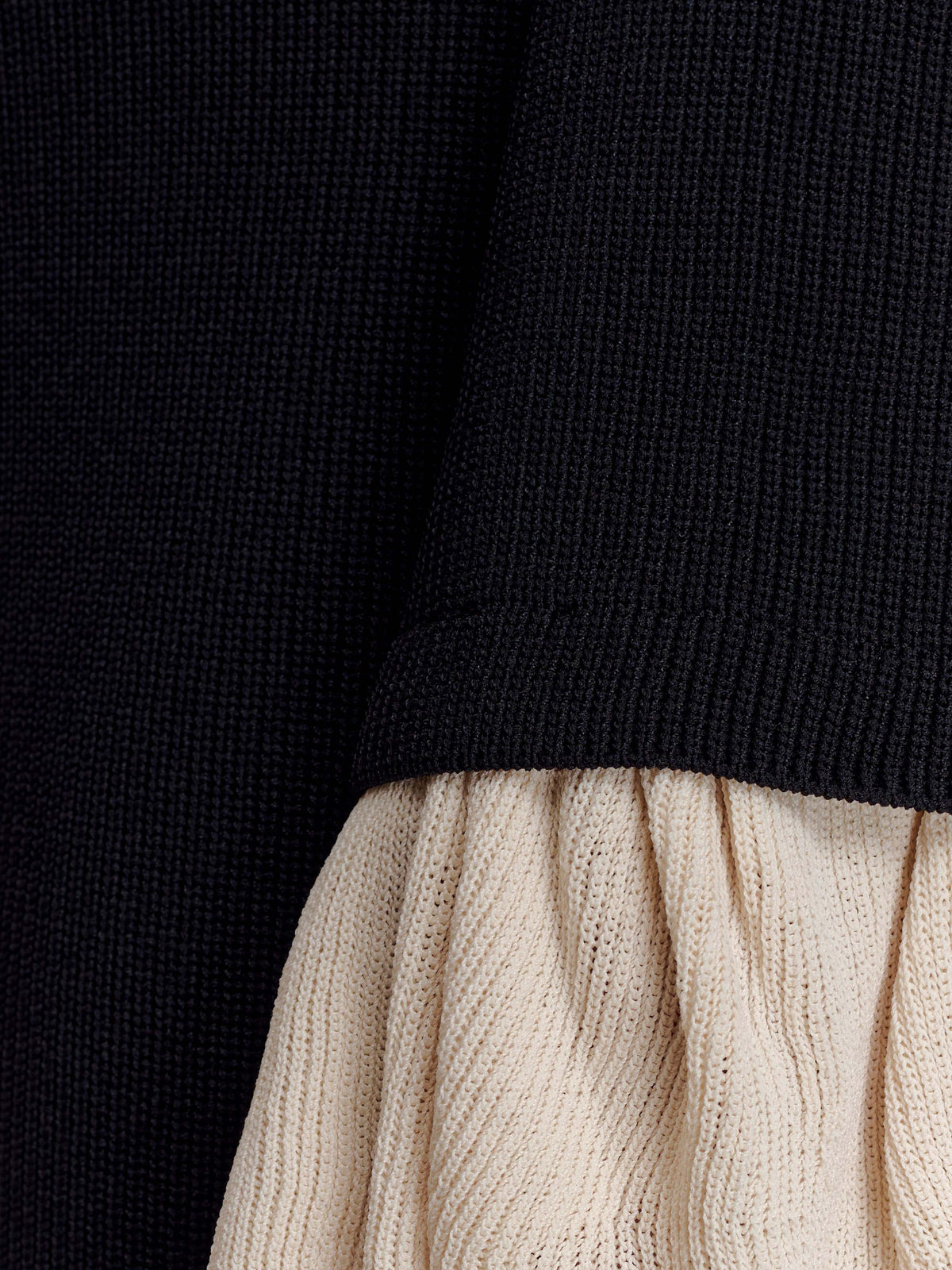 Black midi formal dress with ruffle details, alternate view showing the hem