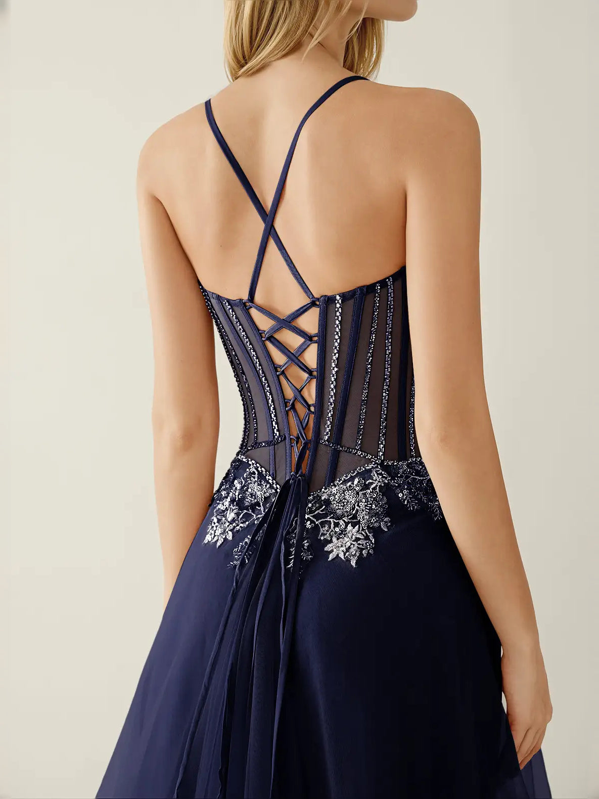 Navy Blue floor-length prom dress, back view showing the rear of the dress showing the garment from a different position