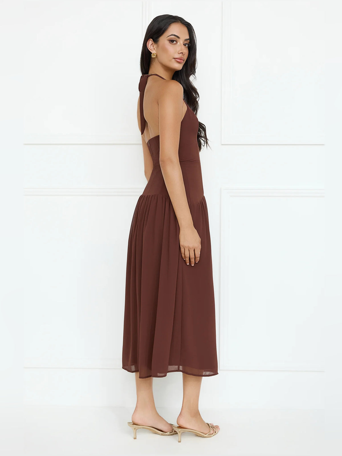 Brown midi formal dress with halter neckline, alternate view showing the hem