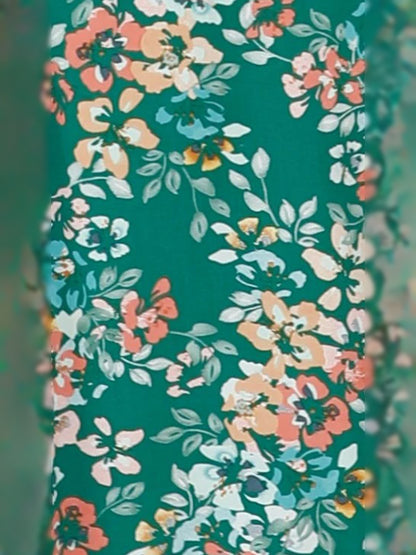 Green Floral midi formal dress with floral print, alternate view showing the hem