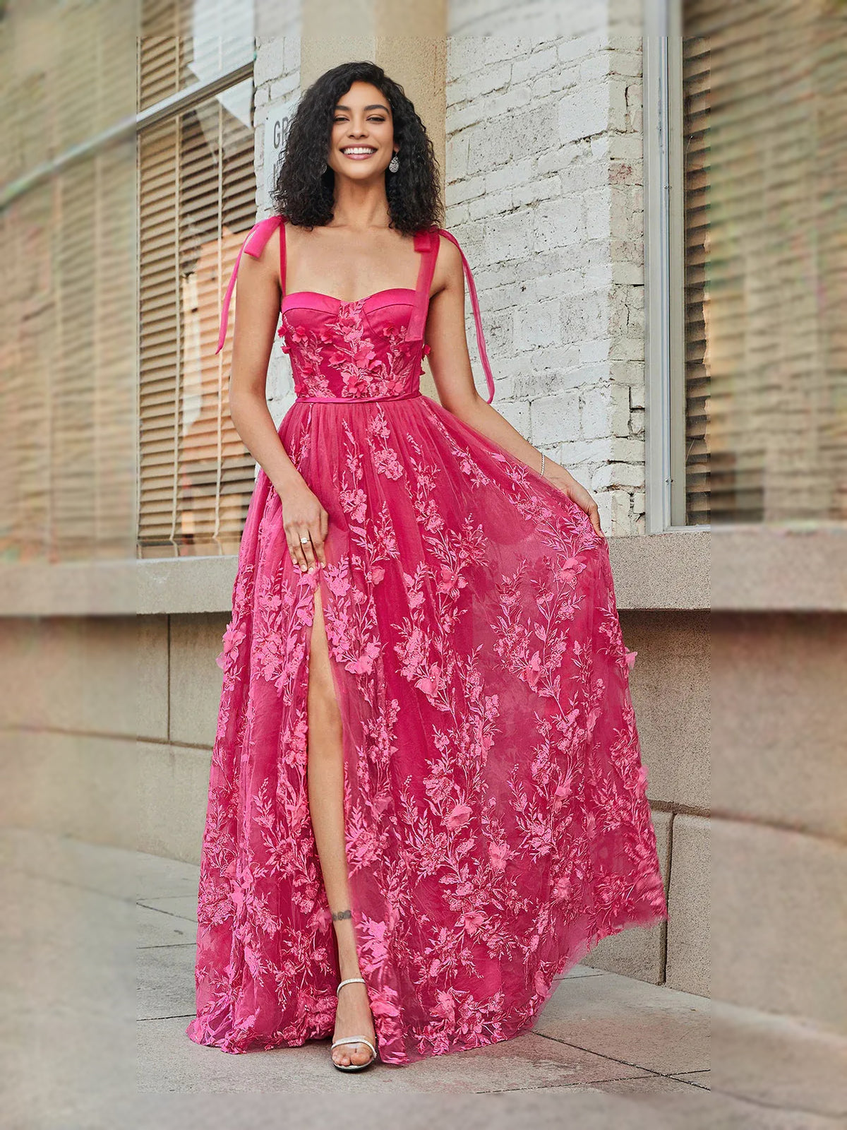 Hot Pink floor-length prom dress, back view showing the rear of the dress showing the garment from a different position