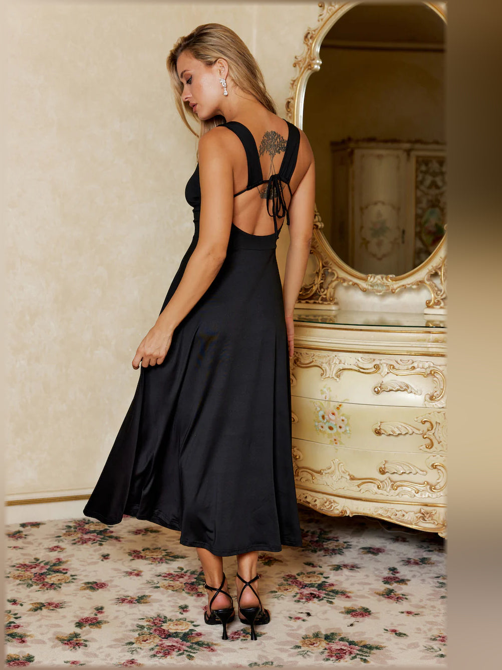 Black midi formal dress, alternate view showing the hem
