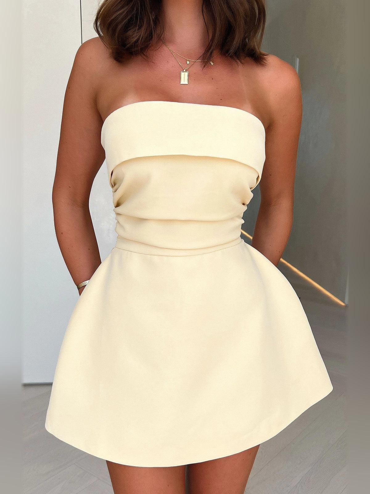 Ivory white mini homecoming dress, alternate view showing the full-length silhouette from another angle