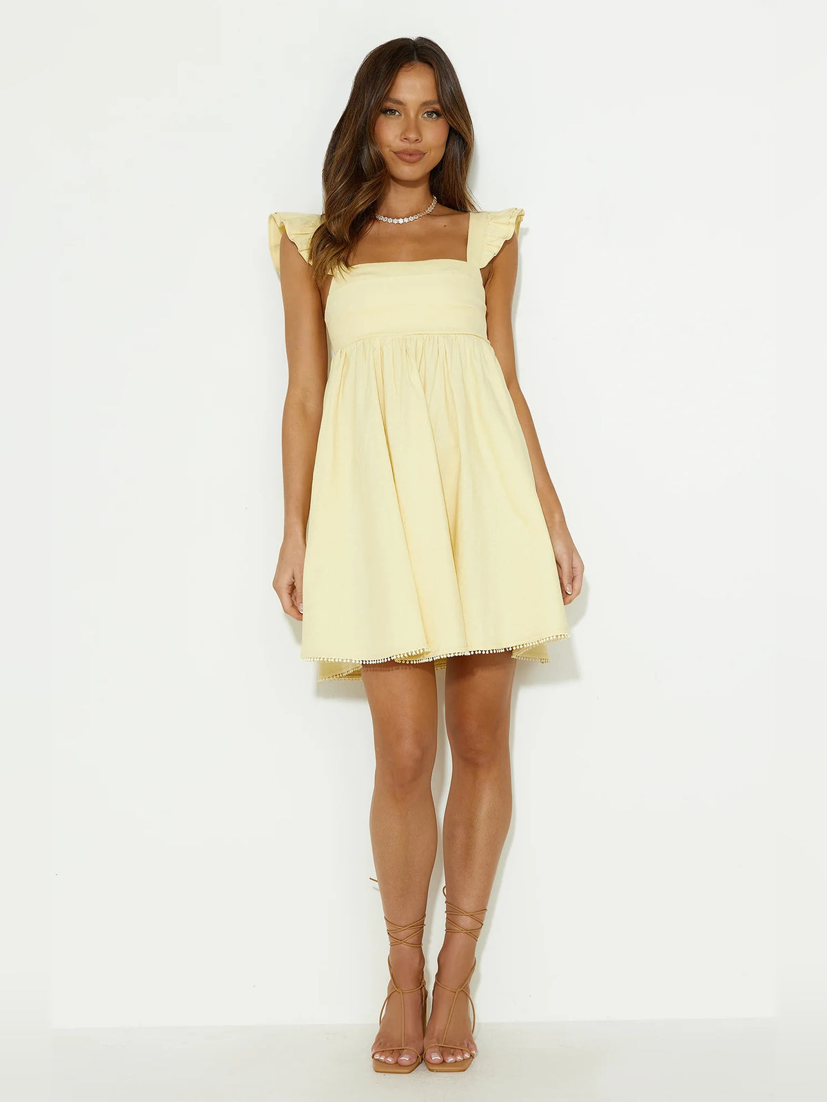 Yellow mini homecoming dress, alternate view showing the full-length silhouette