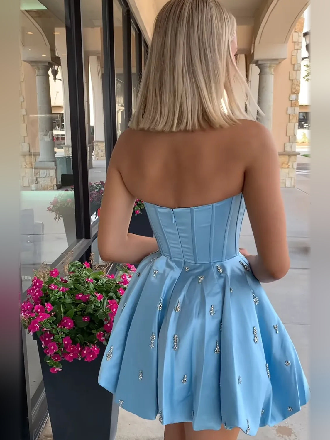 White mini homecoming dress, alternate view showing the full-length silhouette from another angle