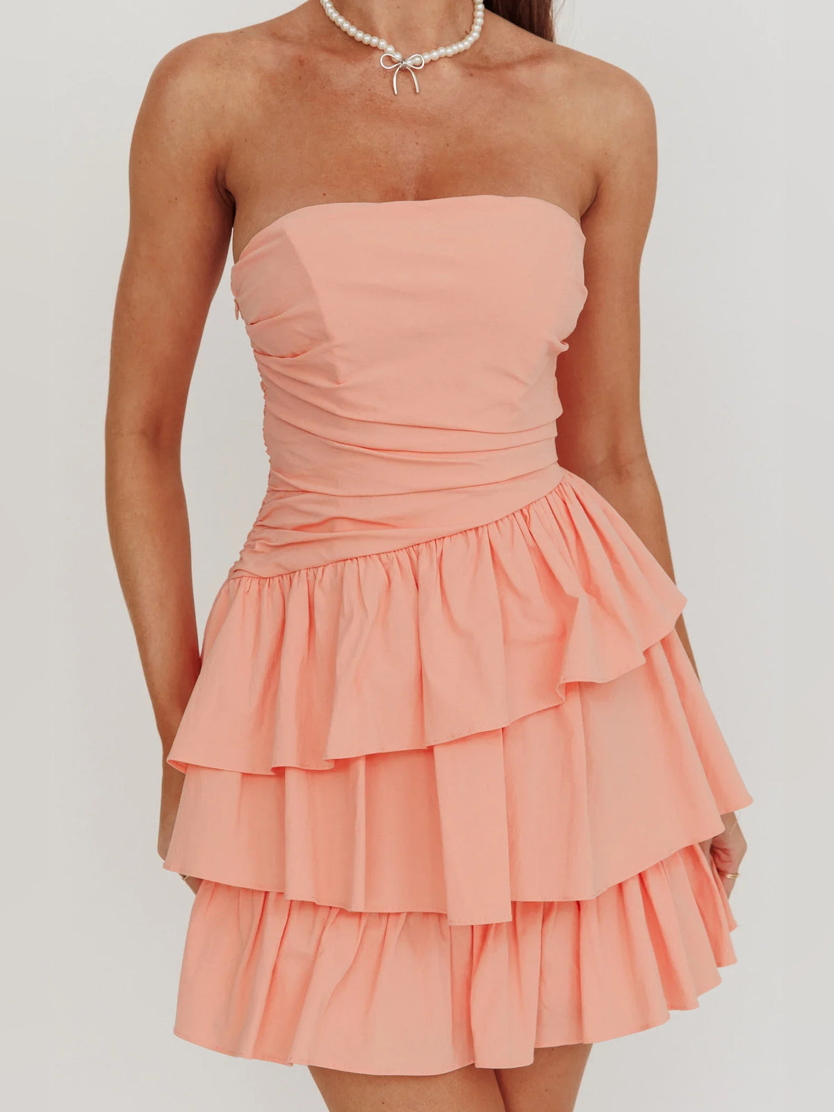Ivory mini homecoming dress, alternate view showing the full-length silhouette from another angle