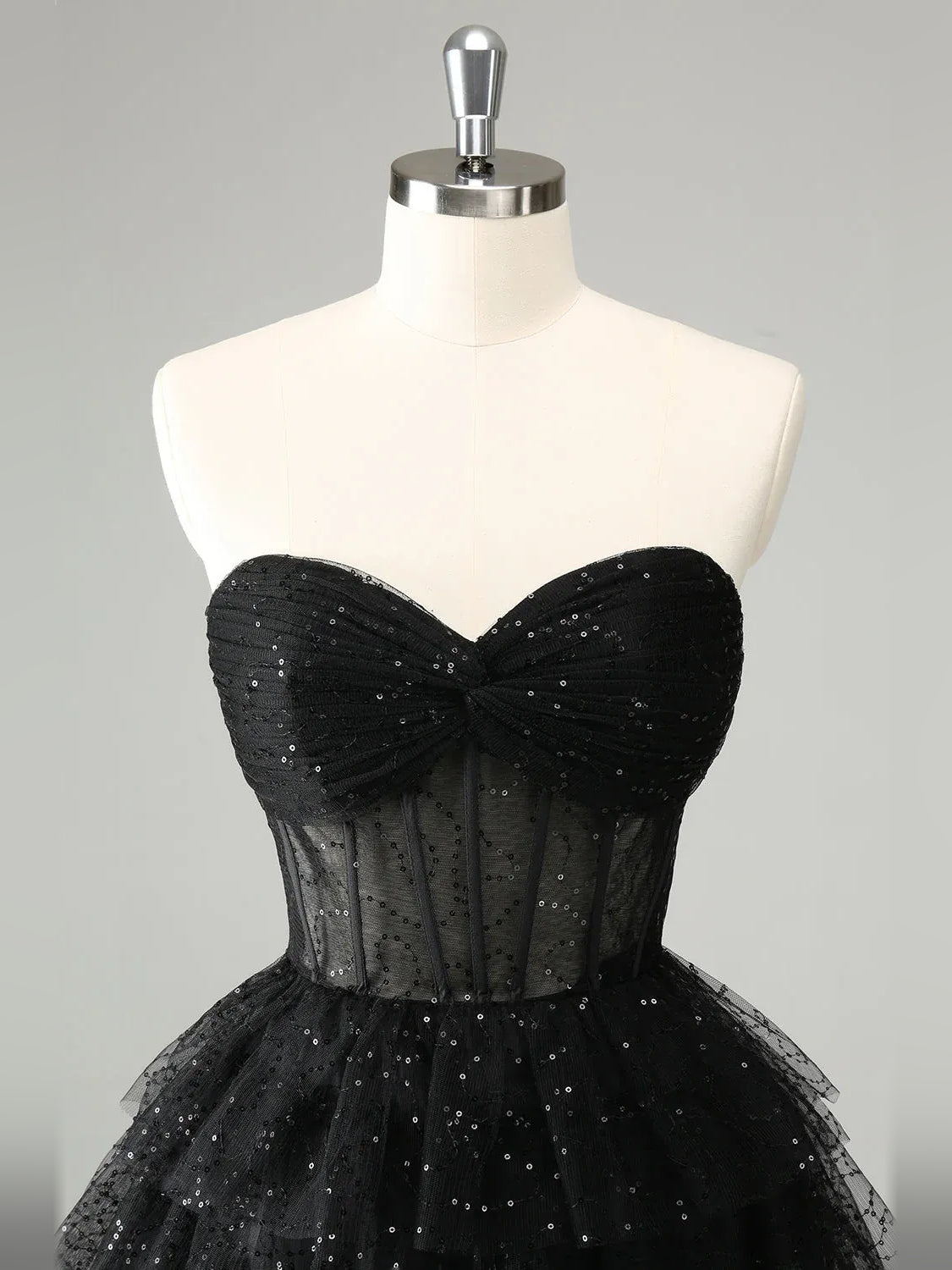 Black mini homecoming dress, alternate view showing the full-length silhouette from another angle