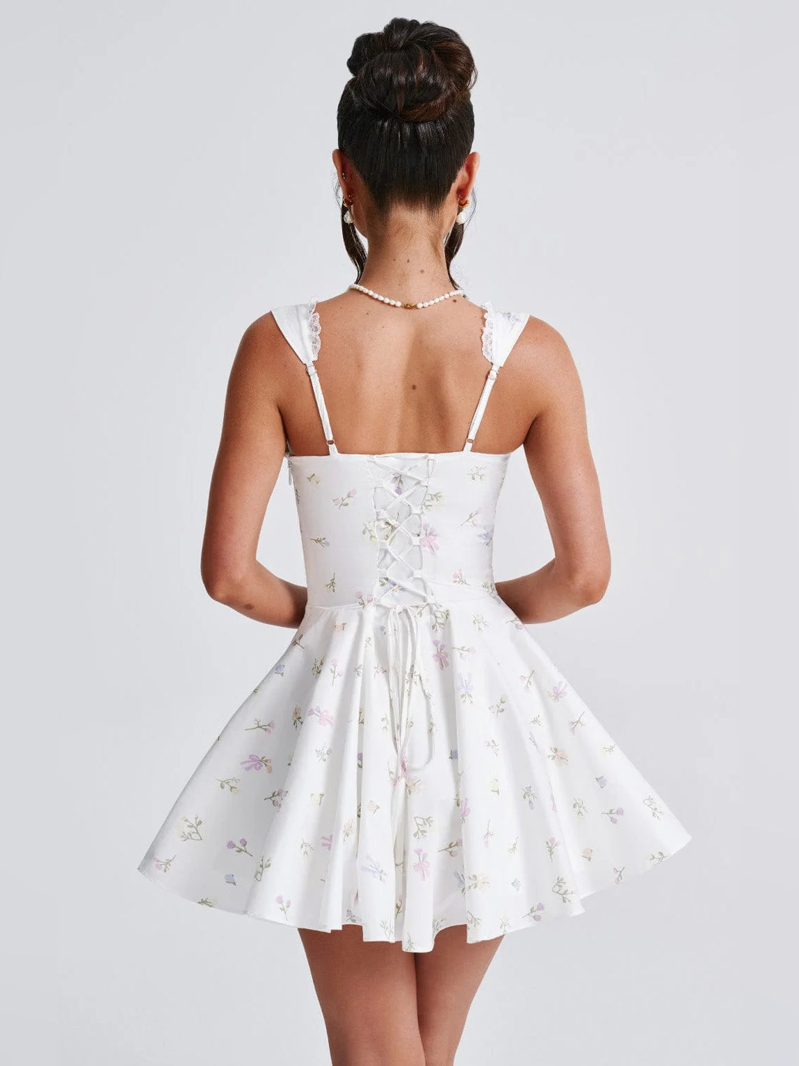 Floral mini homecoming dress, alternate view showing the full-length silhouette