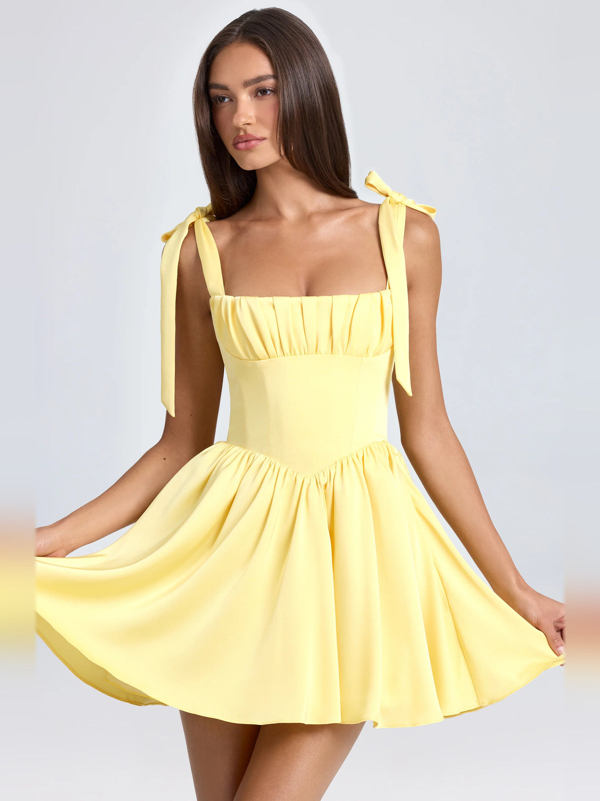 Yellow mini homecoming dress, alternate view showing the full-length silhouette