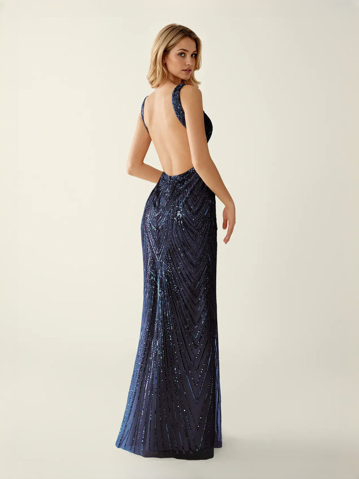Light Pink maxi prom dress, back view showing the rear of the dress showing the garment from a different position