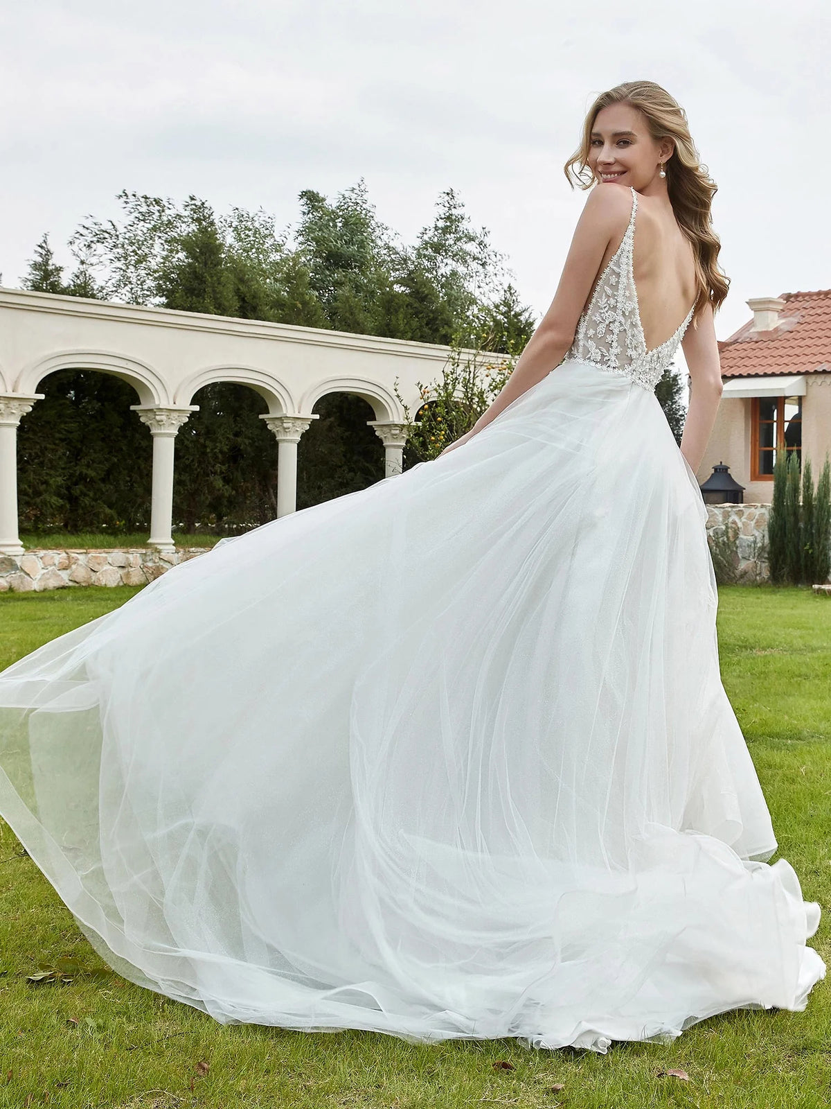 Ivory floor-length wedding dress, alternate view showing the bodice and skirt from another angle