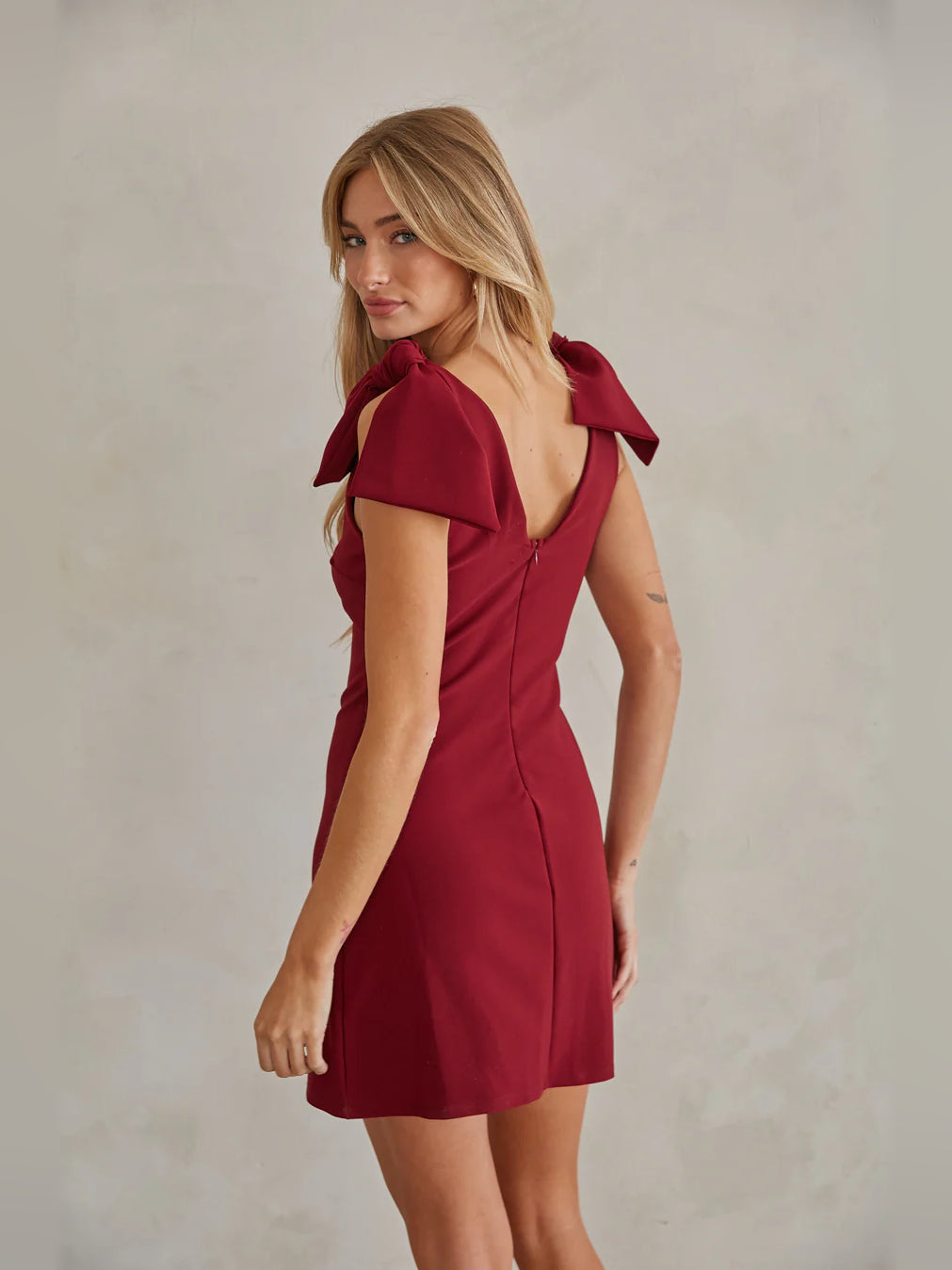 Red mini homecoming dress, alternate view showing the bodice and skirt from another angle