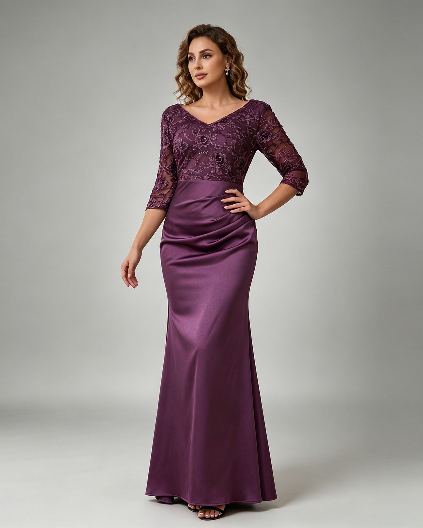 floor length mother of the bride dress with floral lace bodice, V neckline, sheer three-quarter sleeves, and mermaid skirt
