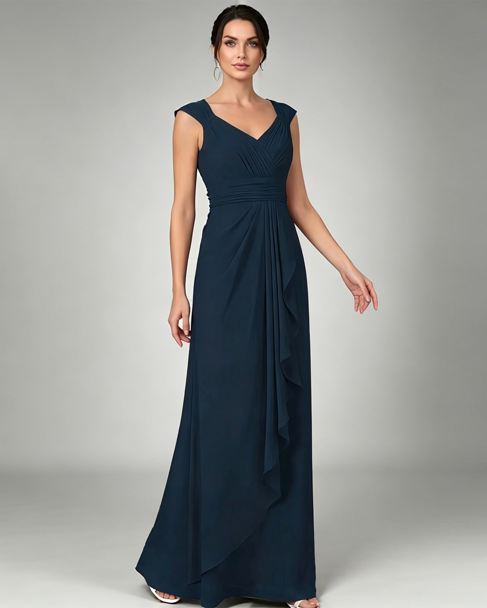 long sleeveless V-neck chiffon mother of the bride gown with pleated bodice and cascading ruffle detail