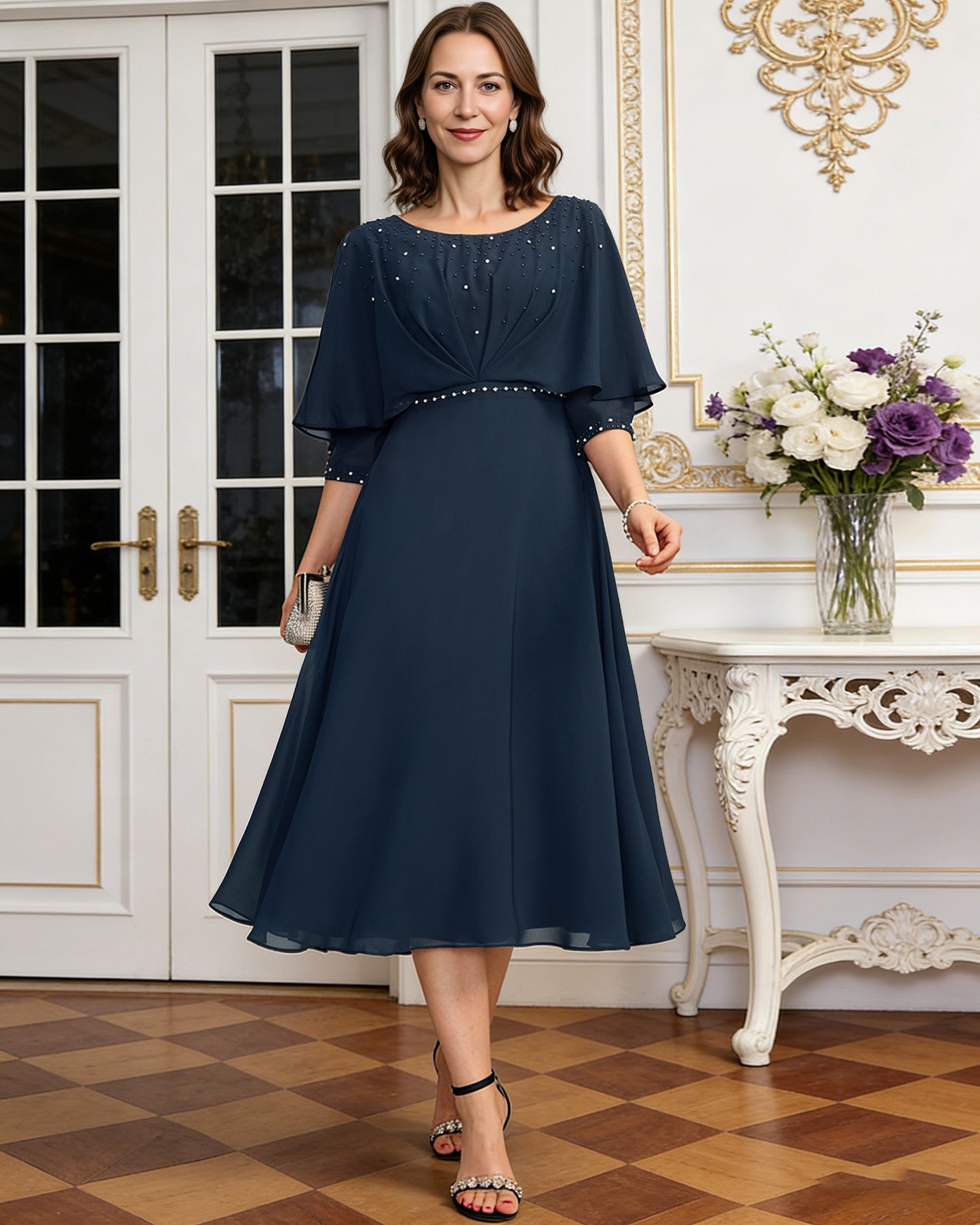 tea length chiffon mother of the bride dress with beaded cape overlay and A-line skirt