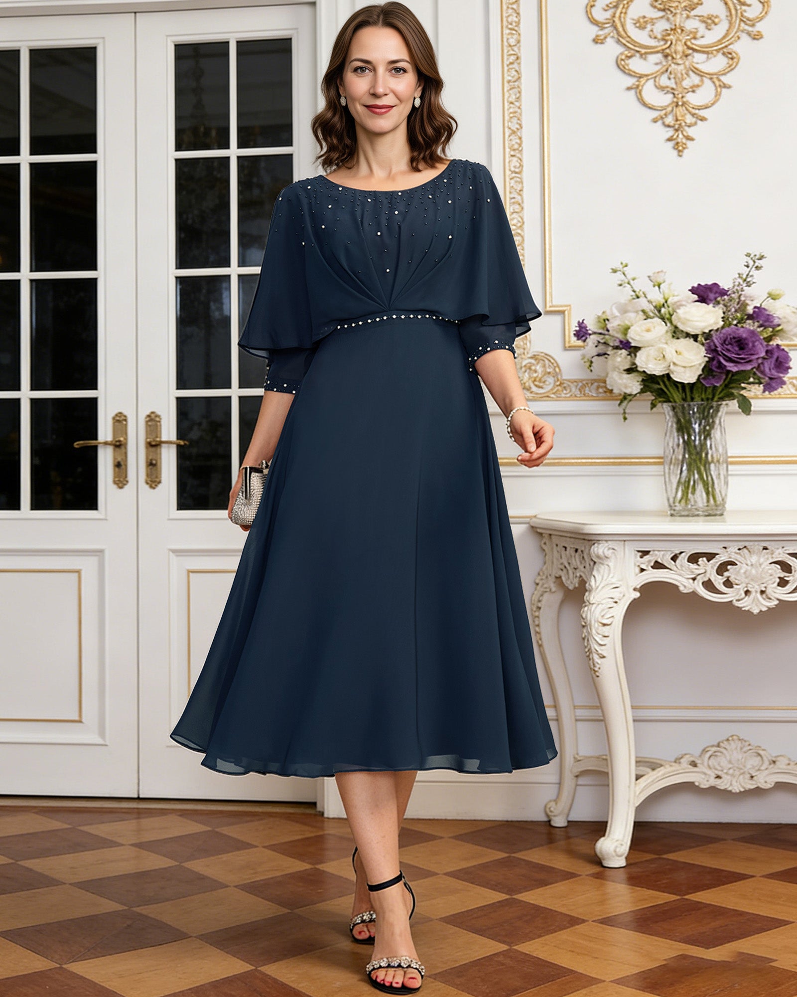 tea length chiffon mother of the bride dress with beaded cape overlay and A-line skirt