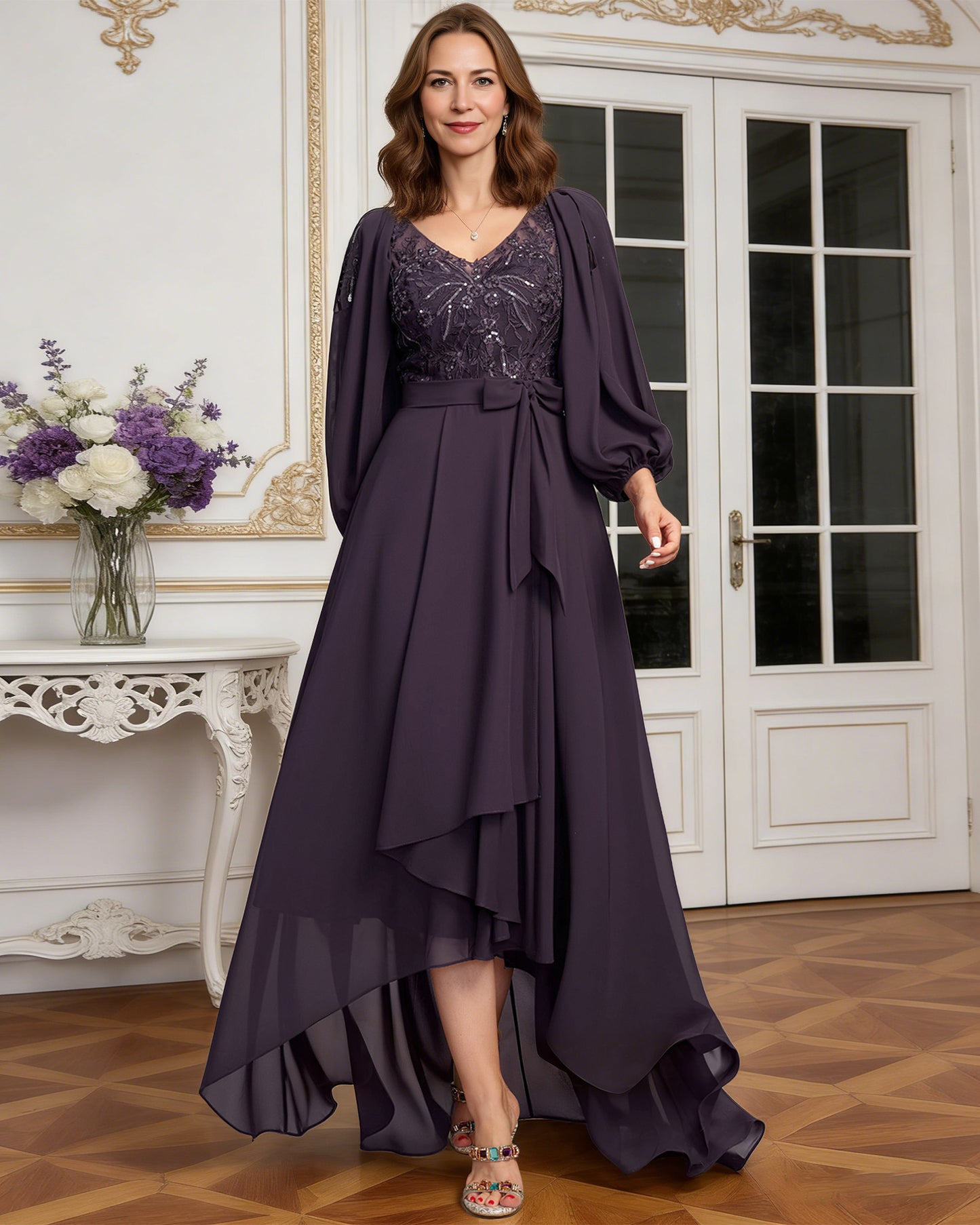 high low mother of the bride dress with lace bodice, chiffon jacket sleeves, tie waist, and layered skirt