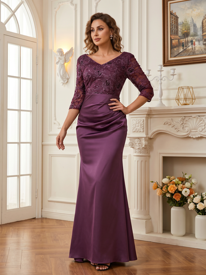 long lace mermaid mother of the bride dress with draped waist detail and fitted satin skirt
