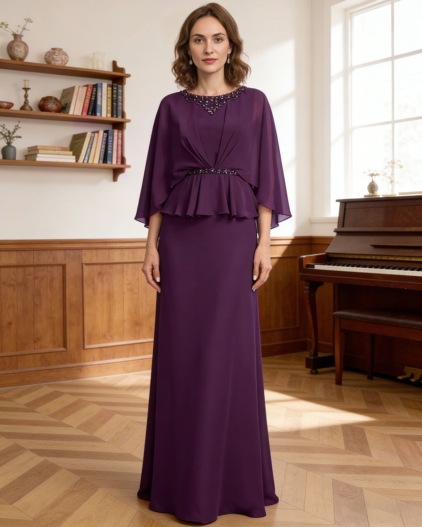 long capelet mother of the bride dress with beaded neckline, peplum overlay, and floor length chiffon skirt shown in formal wedding guest styling