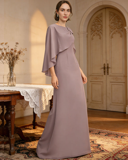 long cape sleeve mother of the bride dress with jewel neckline, bow shoulder, and chiffon column skirt shown in formal wedding guest styling