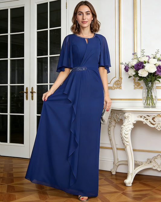 long chiffon mother of the bride A-line dress with flutter sleeves, beaded waist, and side ruffle shown in formal wedding guest styling