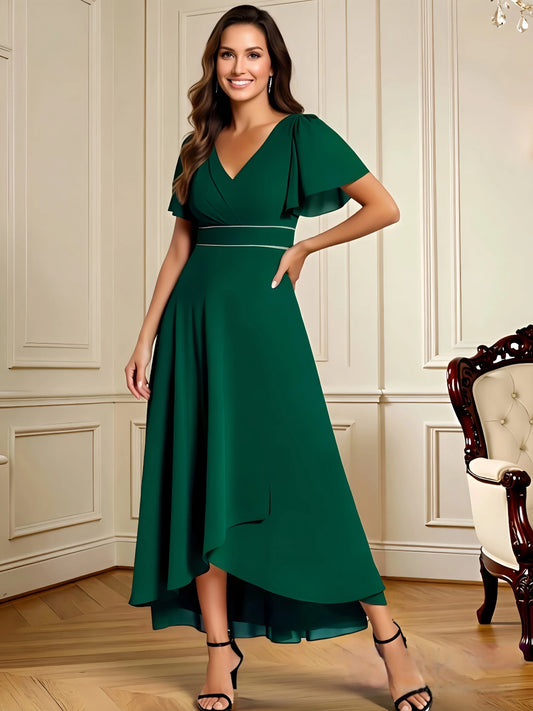 high low mother of the bride dress with V-neck, flutter sleeves, and flowing chiffon skirt shown in a formal wedding guest setting