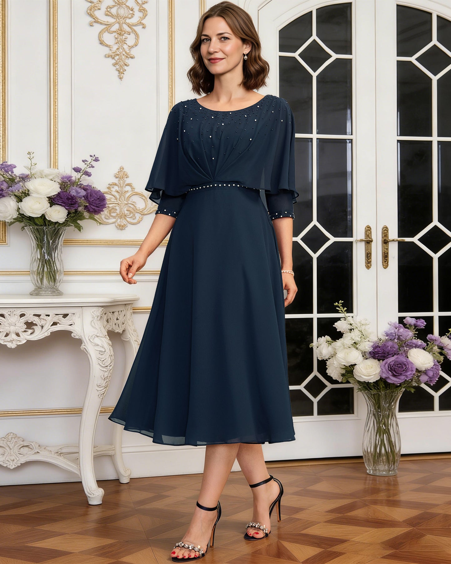 tea length chiffon mother of the bride dress with beaded cape overlay and A-line skirt full outfit view for ceremony and reception occasions