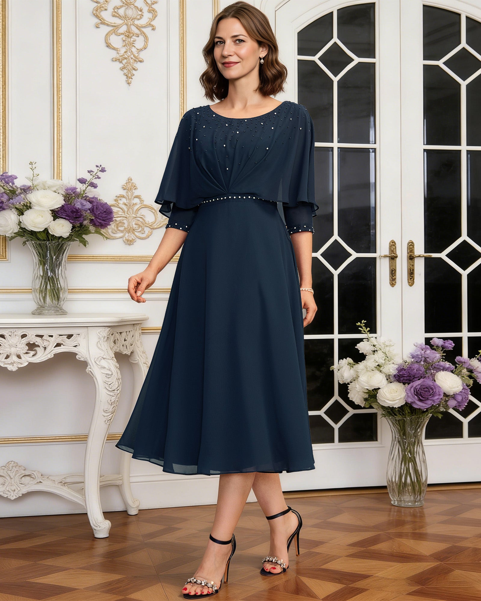 tea length chiffon mother of the bride dress with beaded cape overlay and A-line skirt full outfit view for ceremony and reception occasions