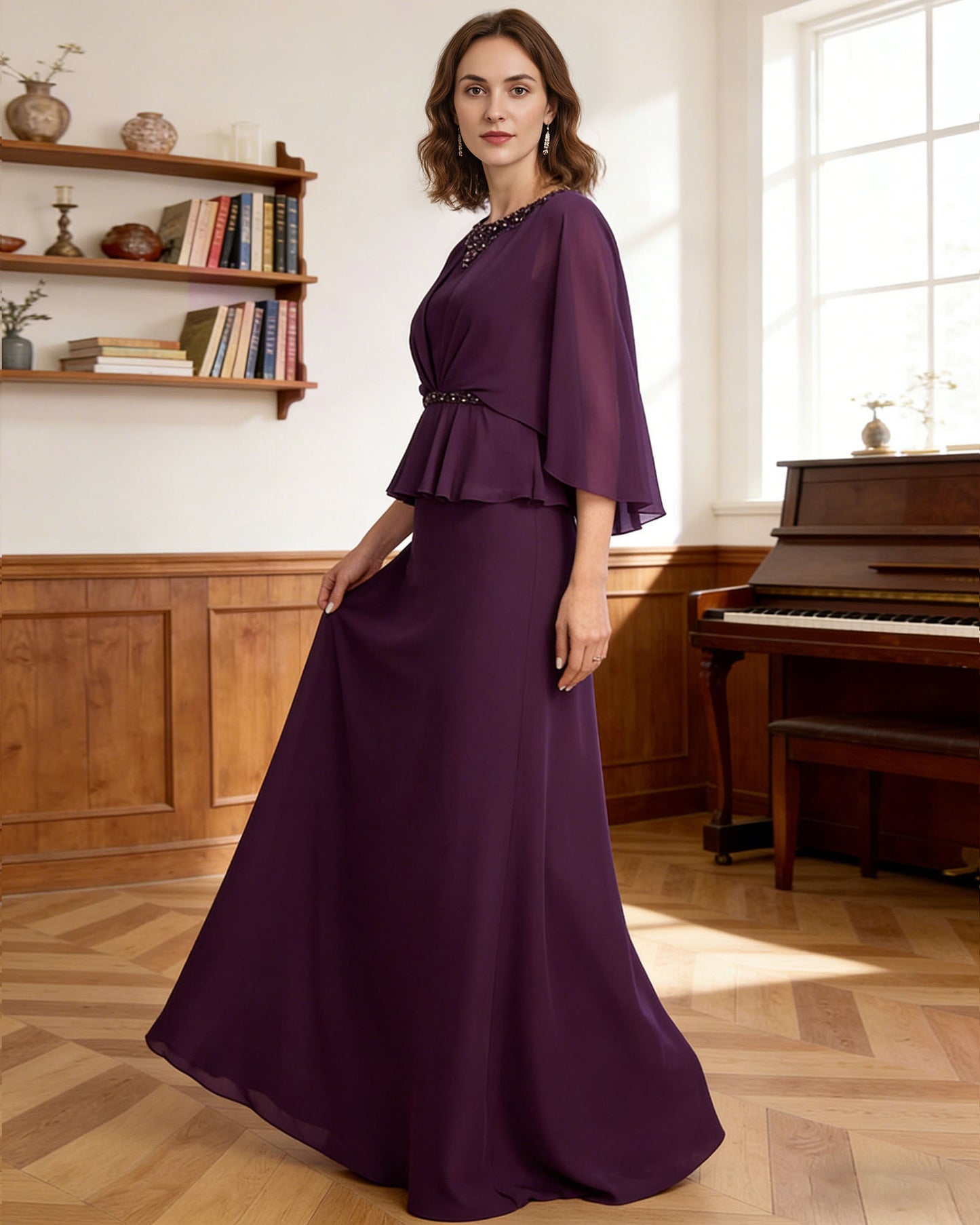 long capelet mother of the bride dress with beaded neckline, peplum overlay, and floor length chiffon skirt full outfit view for ceremony and reception occasions