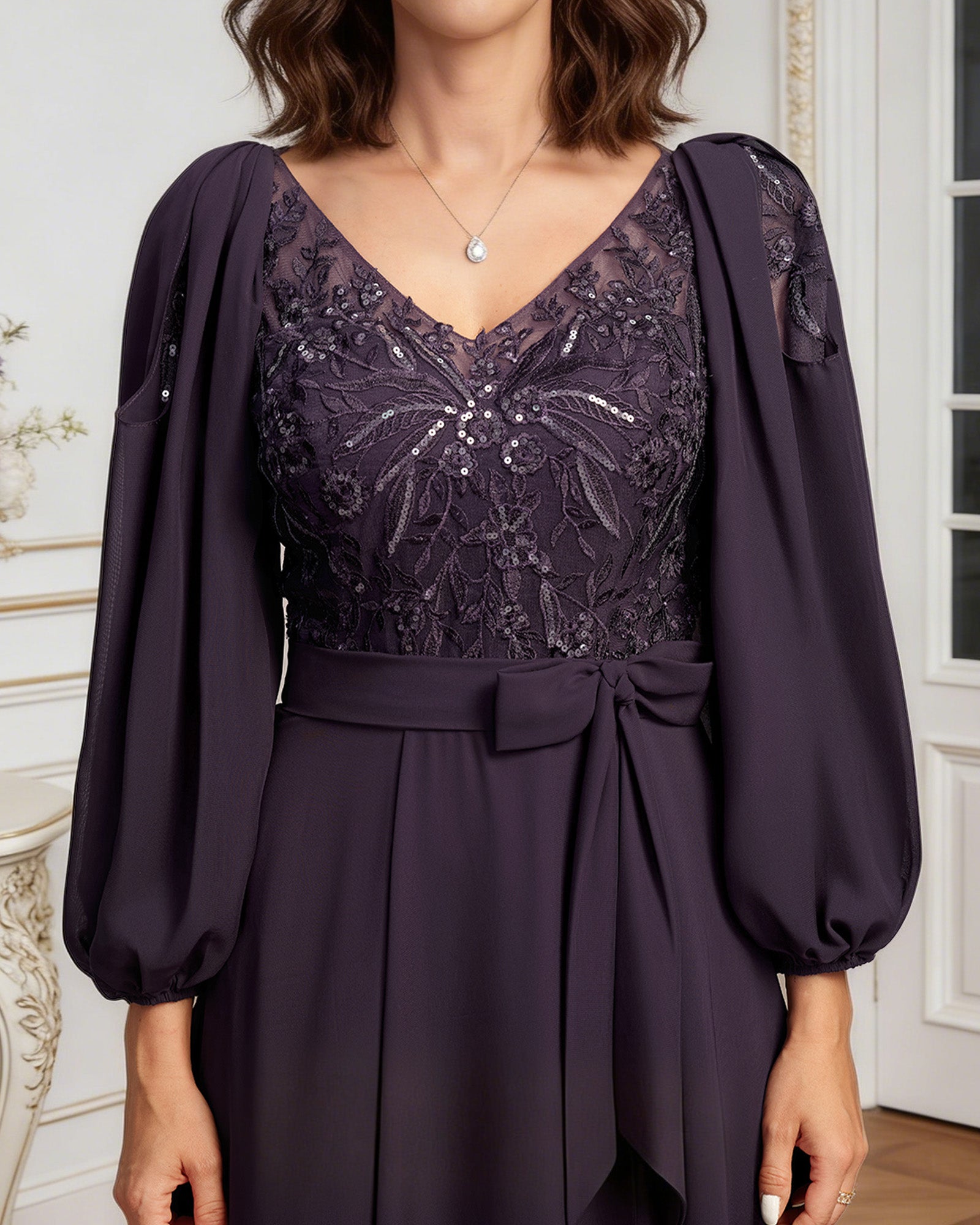 high low mother of the bride dress with lace bodice, chiffon jacket sleeves, tie waist, and layered skirt full outfit view for ceremony and reception occasions