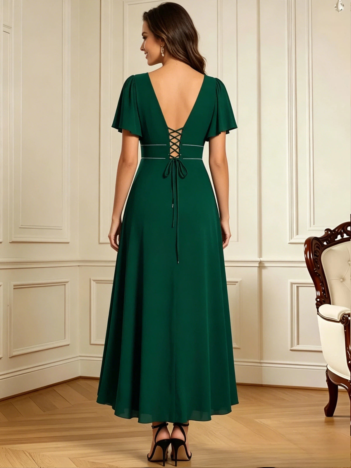high low mother of the bride dress with V-neck, flutter sleeves, and flowing chiffon skirt front detail highlighting the neckline, waist, and sleeves