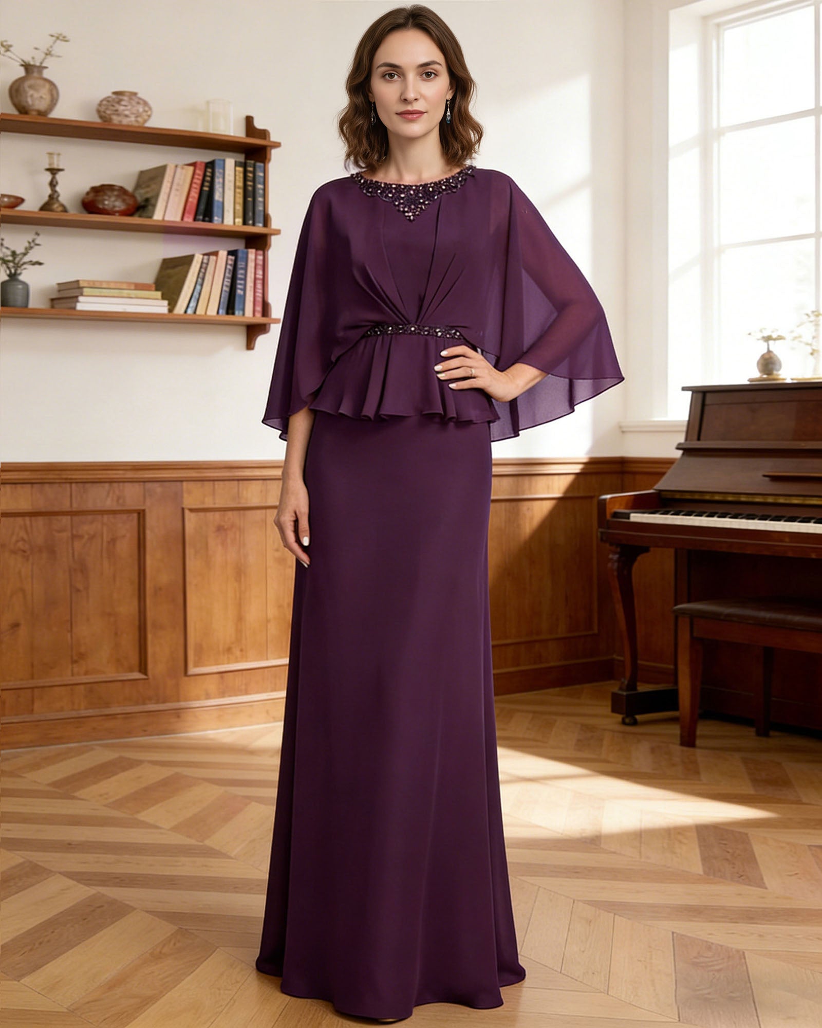 long capelet mother of the bride dress with beaded neckline, peplum overlay, and floor length chiffon skirt front detail highlighting neckline, sleeves, waist, and fabric