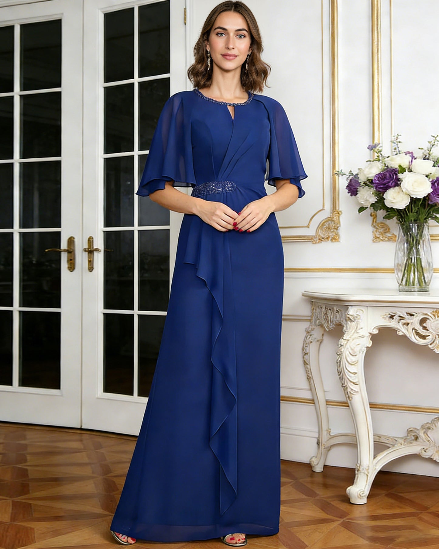 long chiffon mother of the bride A-line dress with flutter sleeves, beaded waist, and side ruffle front detail highlighting neckline, sleeves, waist, and fabric
