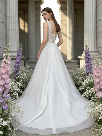 sleeveless V-neck tulle wedding dress with lace bodice and full skirt - image 6