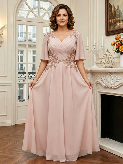 floor length chiffon mother of the bride A-line gown with flutter sleeves and beaded lace applique detail view of the formal dress silhouette and fabric movement