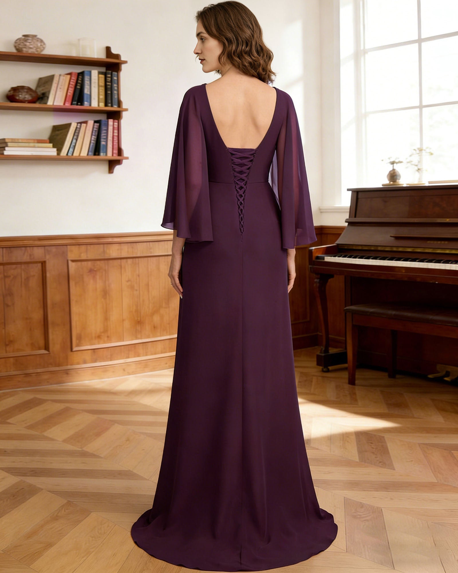 long capelet mother of the bride dress with beaded neckline, peplum overlay, and floor length chiffon skirt back or side view for mother of the bride occasion styling