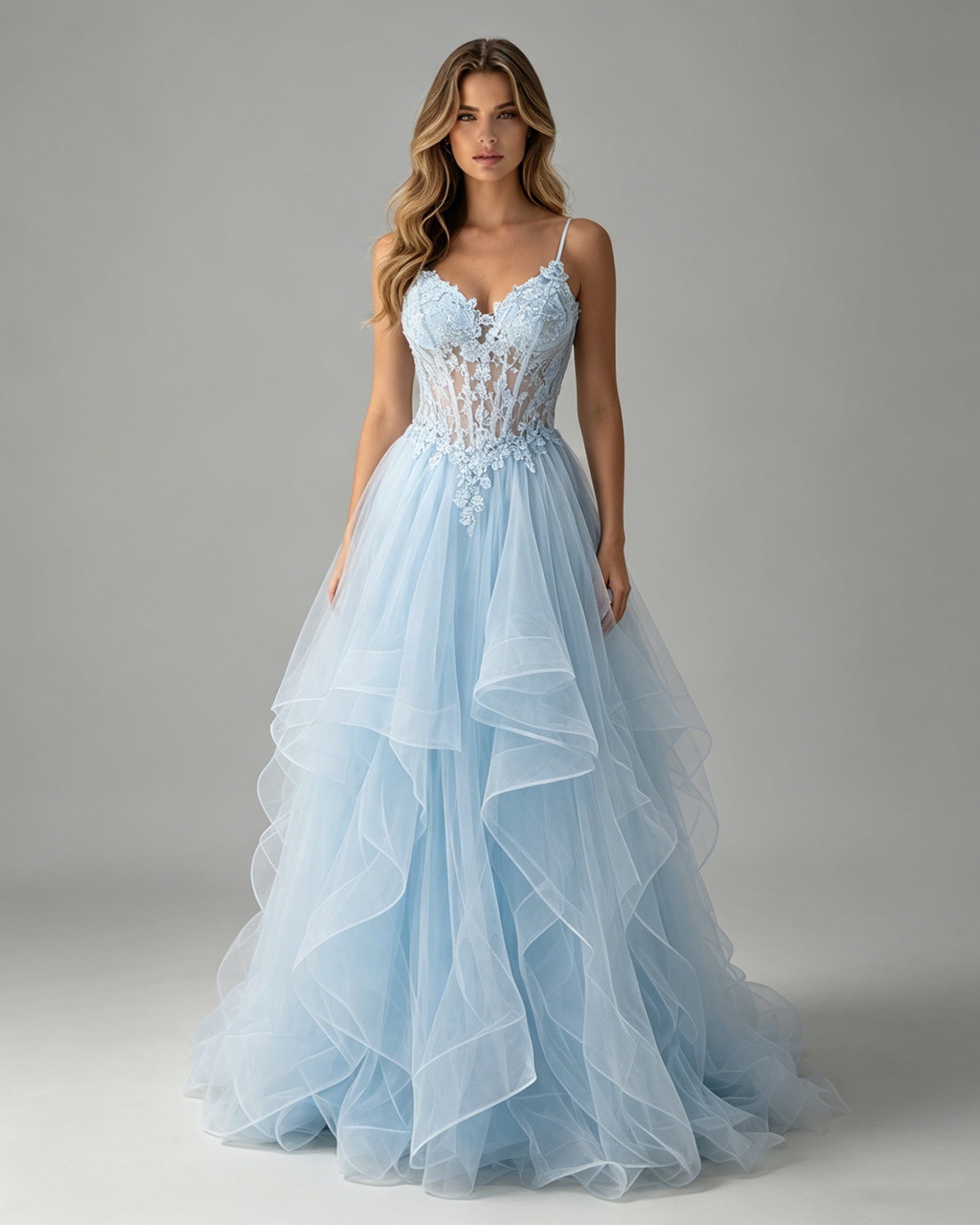 spaghetti strap lace corset tulle prom dress with ruffle skirt shown on model.