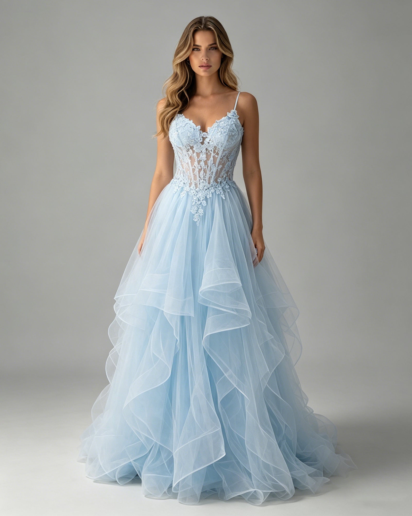 spaghetti strap lace corset tulle prom dress with ruffle skirt shown on model.