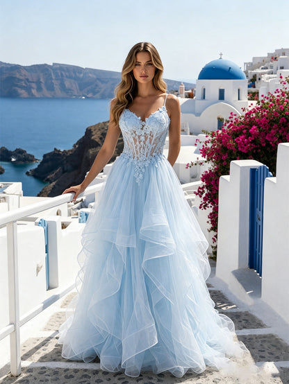 formal dress look featuring a spaghetti strap lace corset bodice, illusion boning, lace-up back, and flowing layered tulle ruffle skirt.
