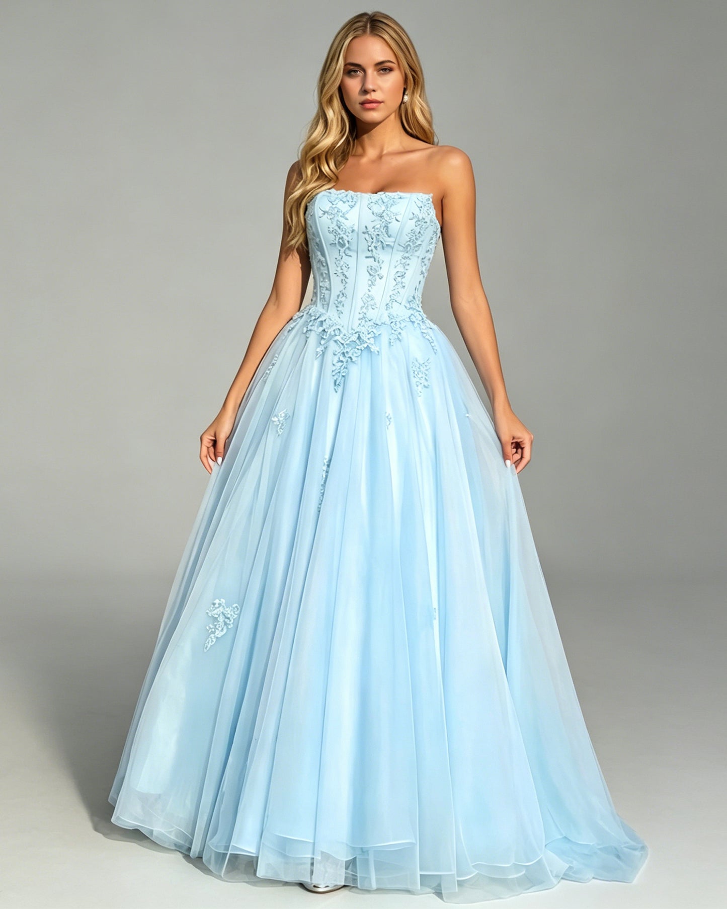 strapless lace corset ball gown with tulle a-line skirt shown on model.