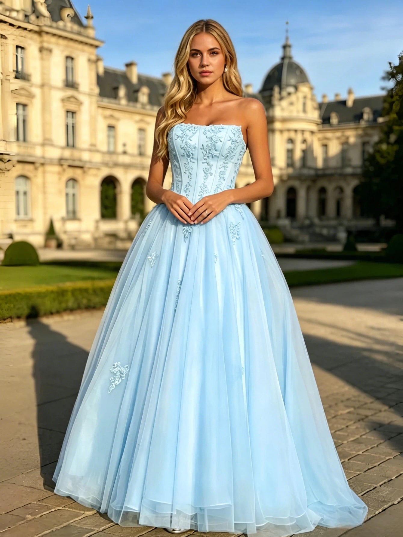 formal dress look featuring a strapless lace applique corset bodice, full-length tulle A-line skirt, and elegant formal ball gown silhouette.