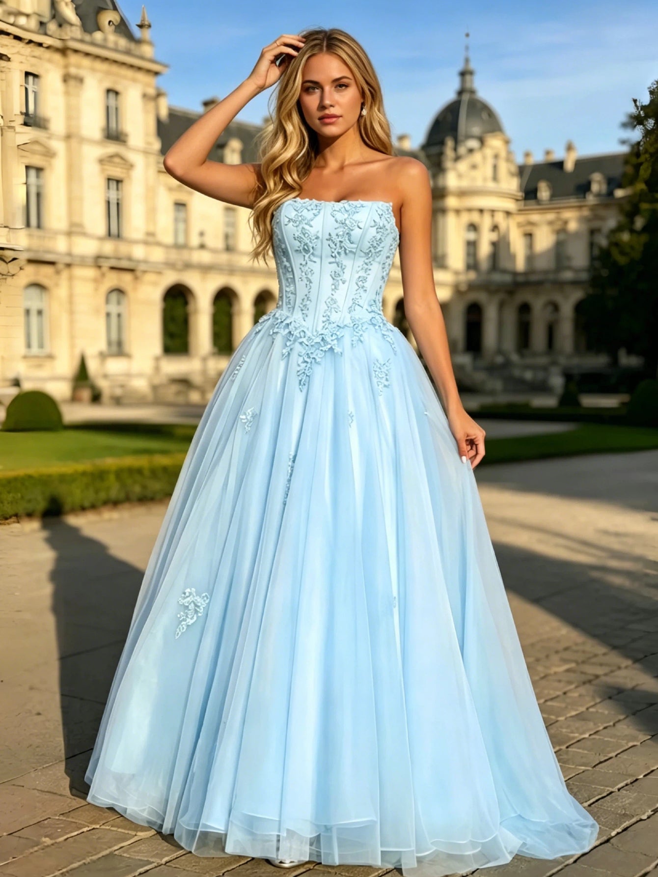 full styling view of strapless lace corset ball gown with tulle a-line skirt.