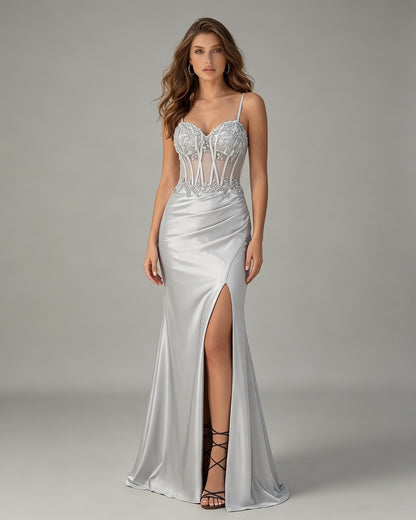 spaghetti strap beaded corset satin prom dress with high slit shown on model.