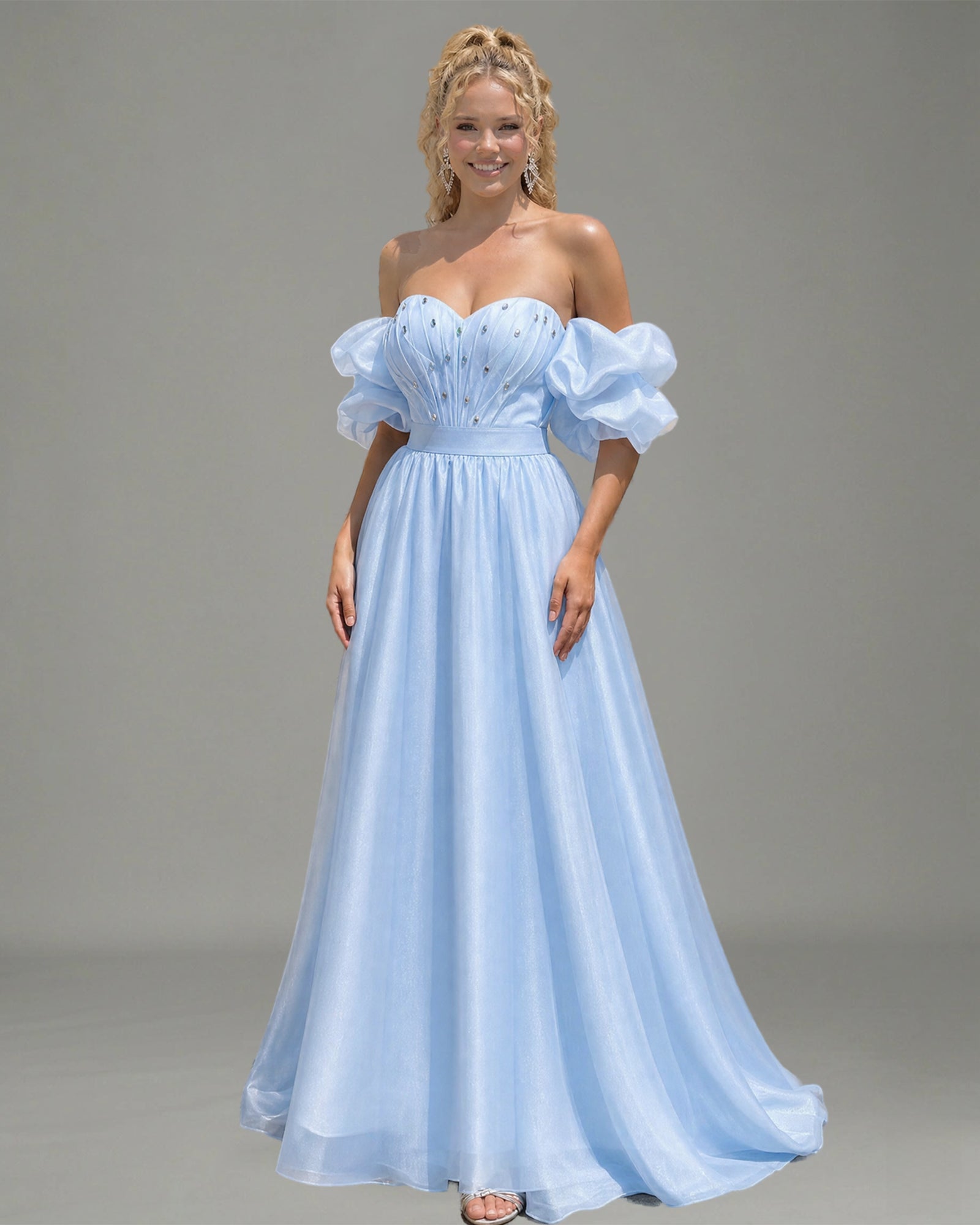 spaghetti strap beaded corset satin prom dress with high slit shown on model.