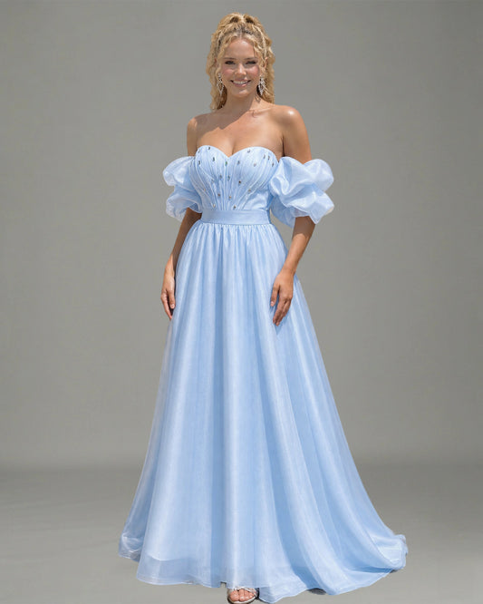 spaghetti strap beaded corset satin prom dress with high slit shown on model.
